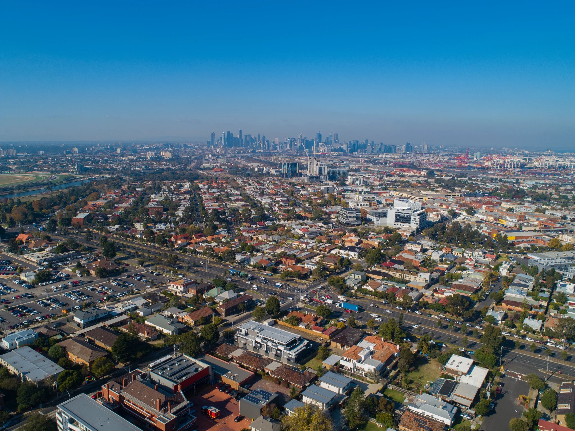 Aerial view of Melbourne northern suburbs with the city skyline in the distance